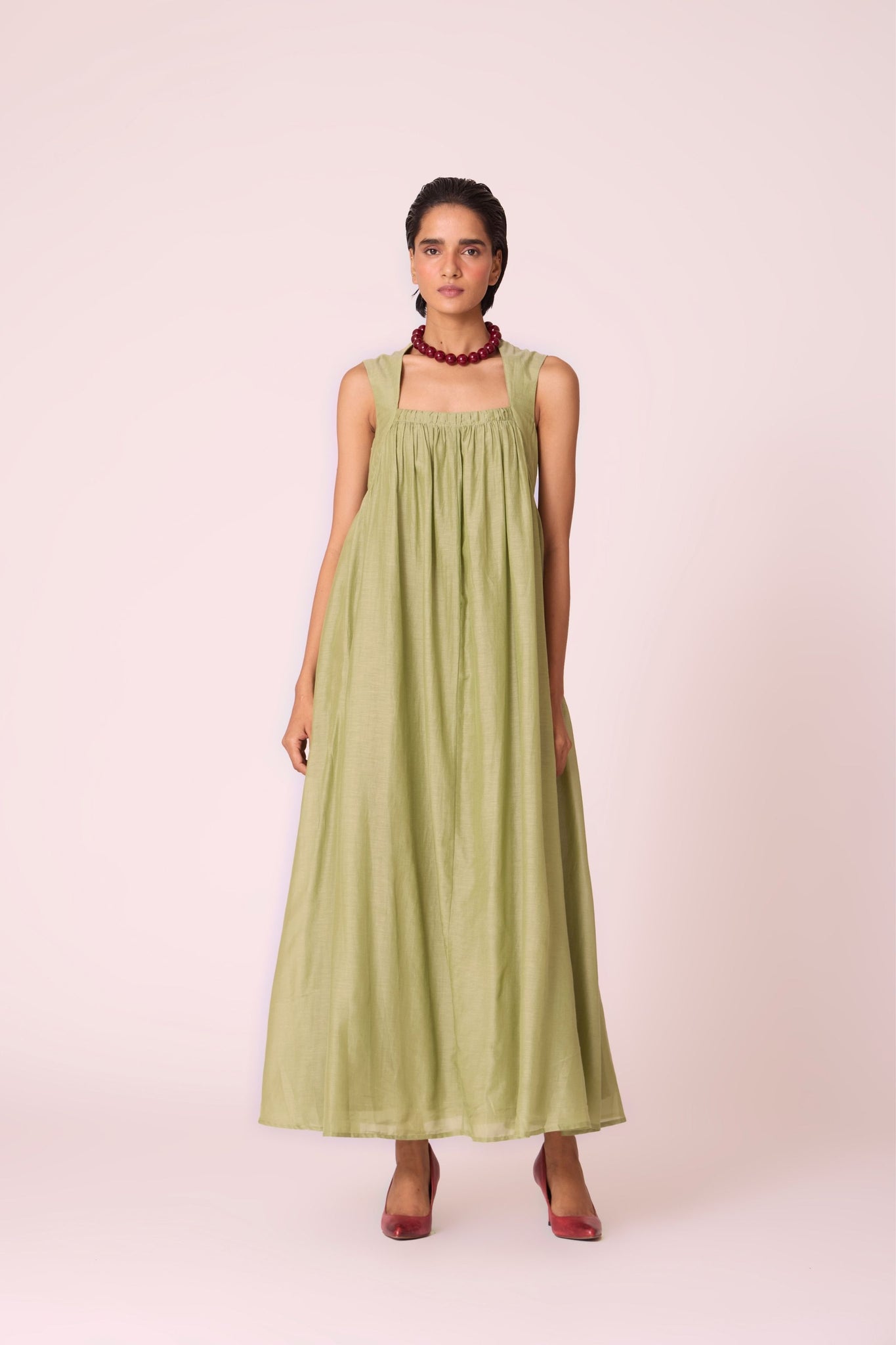 Green silk-cotton maxi dress with square neckline, full lining, in-seam pockets, and concealed side zip.