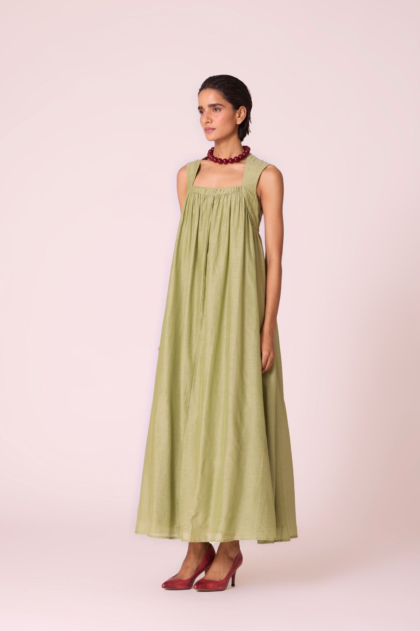 Green silk-cotton maxi dress with square neckline, full lining, in-seam pockets, and concealed side zip.