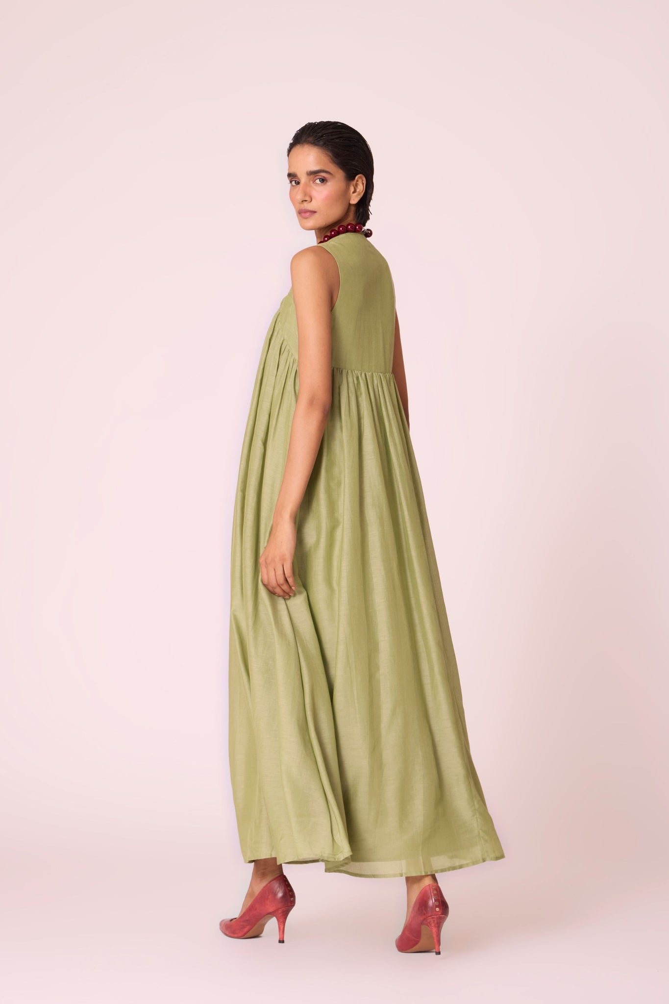 Green silk-cotton maxi dress with square neckline, full lining, in-seam pockets, and concealed side zip.
