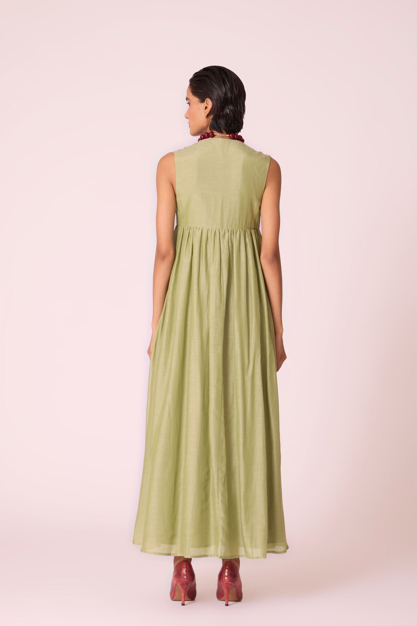 Green silk-cotton maxi dress with square neckline, full lining, in-seam pockets, and concealed side zip.