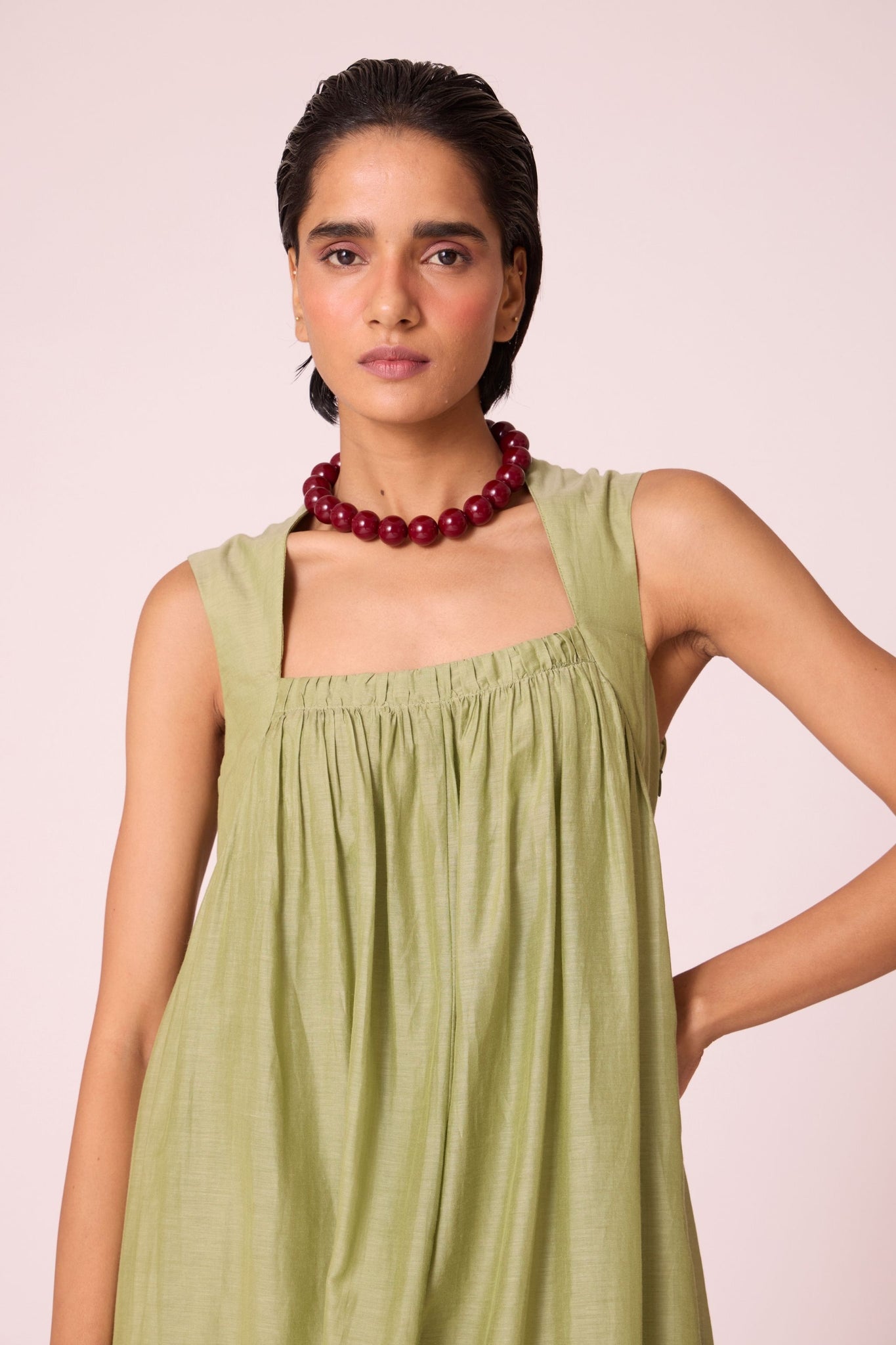 Green silk-cotton maxi dress with square neckline, full lining, in-seam pockets, and concealed side zip.
