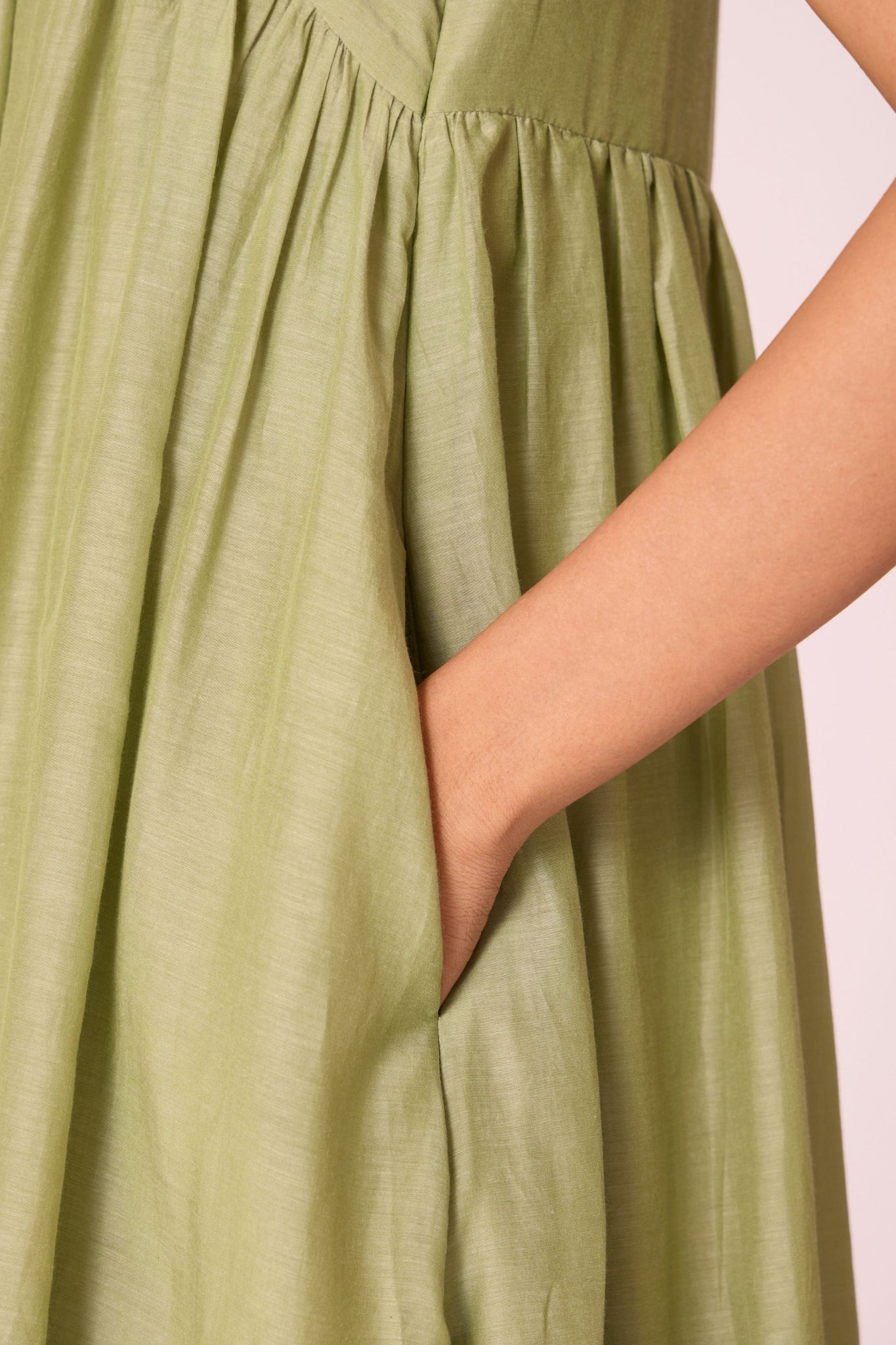 Green silk-cotton maxi dress with square neckline, full lining, in-seam pockets, and concealed side zip.
