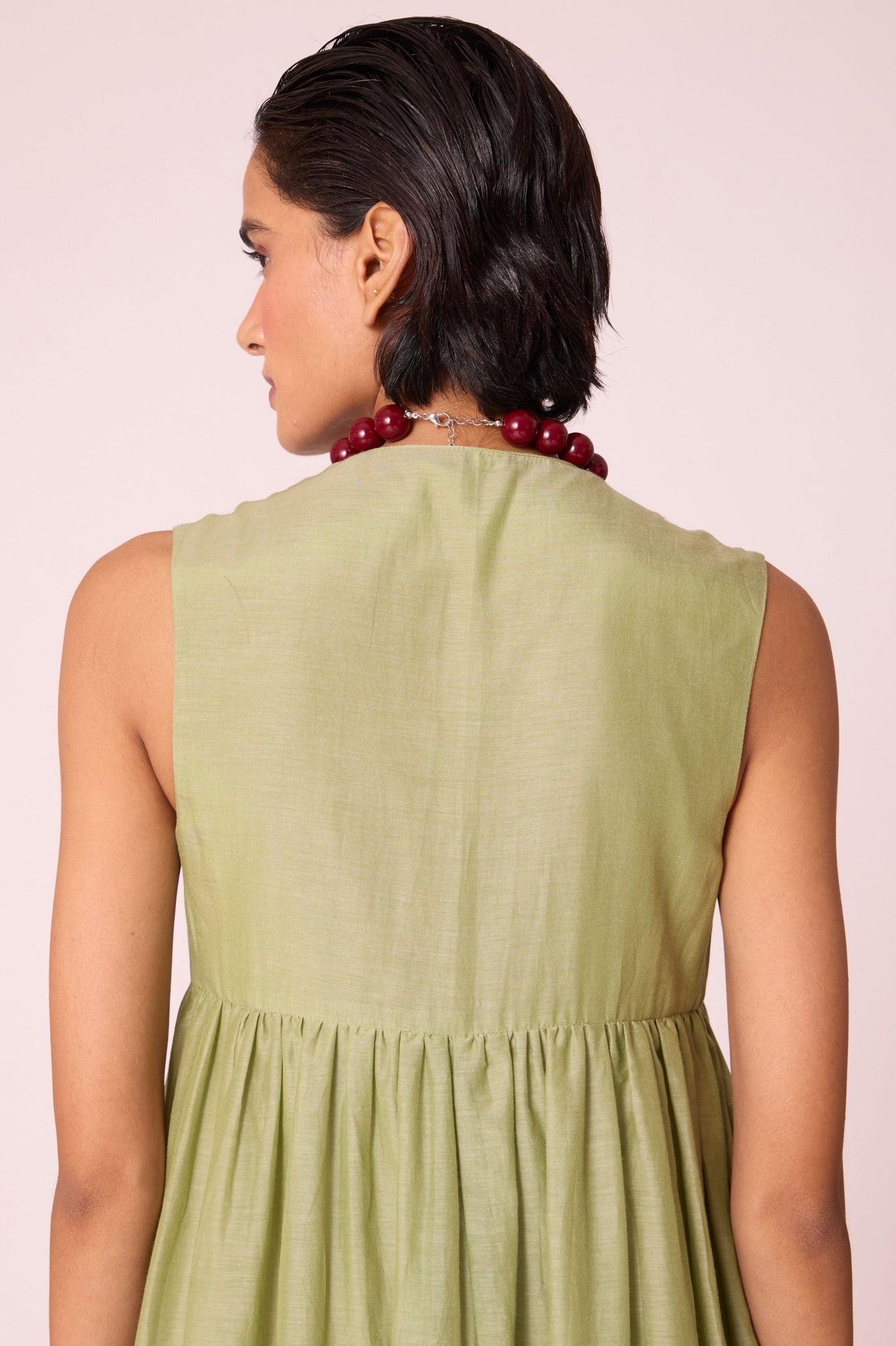 Green silk-cotton maxi dress with square neckline, full lining, in-seam pockets, and concealed side zip.