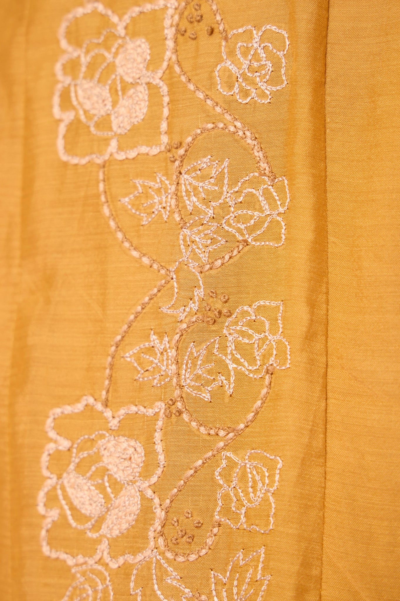 Yellow cupro dress with hand-embroidered keyhole neckline, drop sleeves, full lining, and in-seam pockets.
